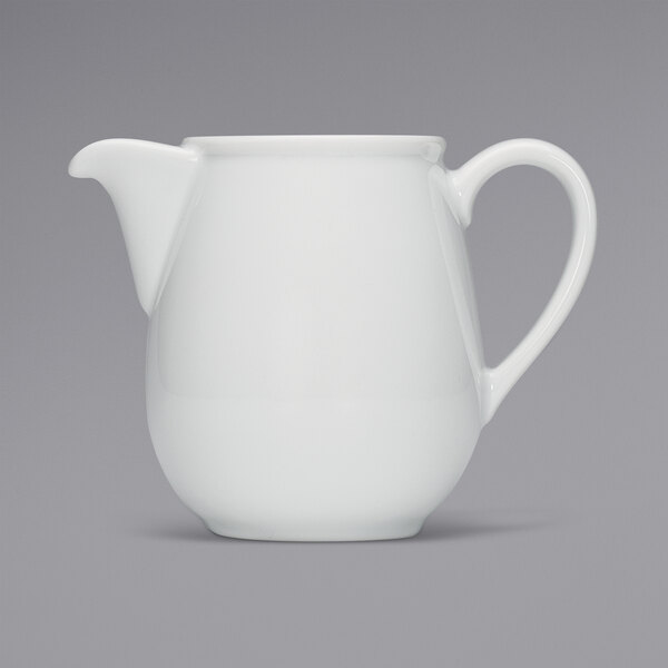 A Bauscher bright white porcelain coffee pot with a white handle.