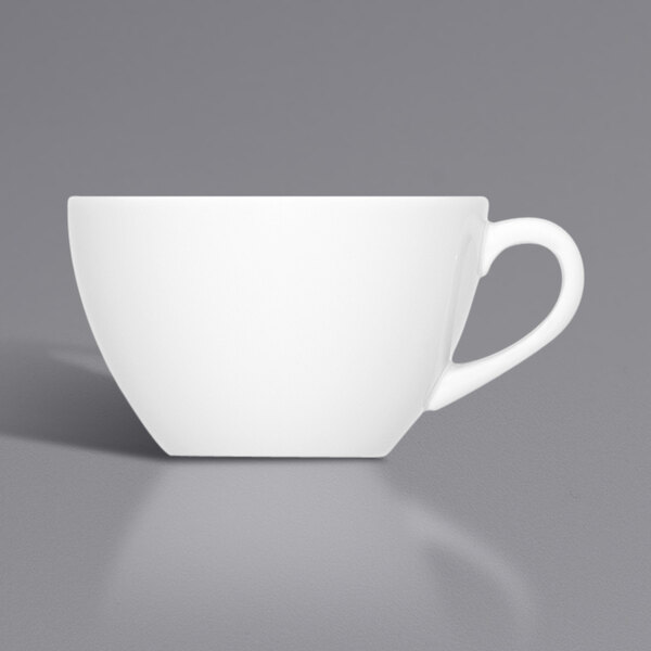 A white Bauscher porcelain cup with a handle.