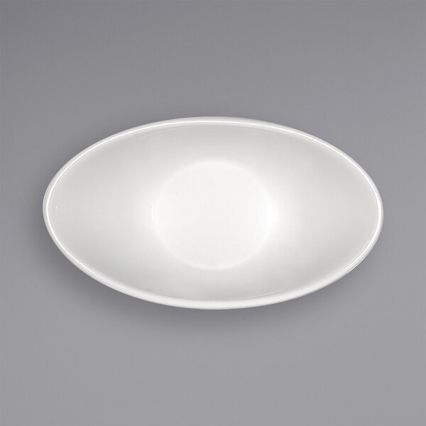 A bright white oval porcelain sauce dish.