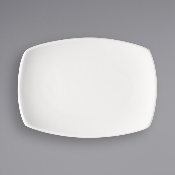 A Bauscher bright white rectangular porcelain platter with a small rim.