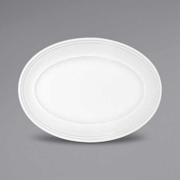 A Bauscher bright white oval platter with a wide rim.