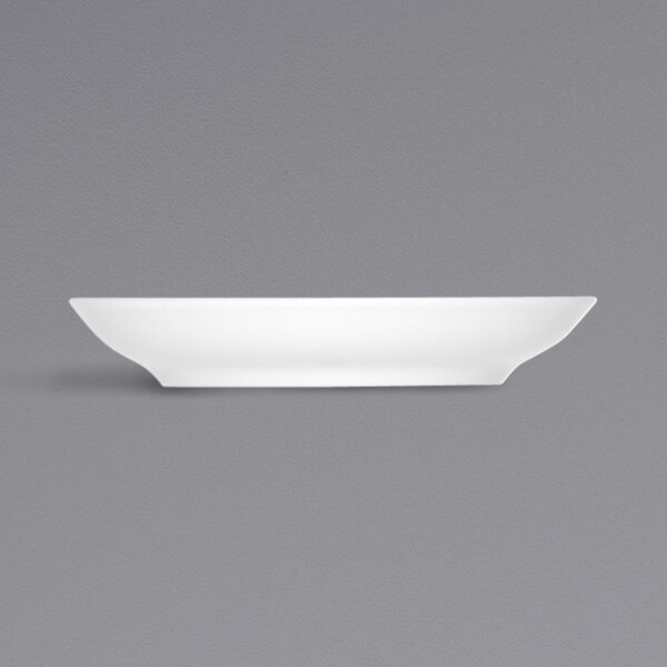 A Bauscher bright white porcelain saucer on a white background.