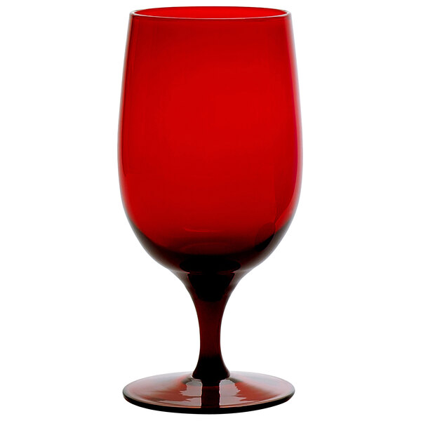 A close up of a Fortessa ruby red wine glass.