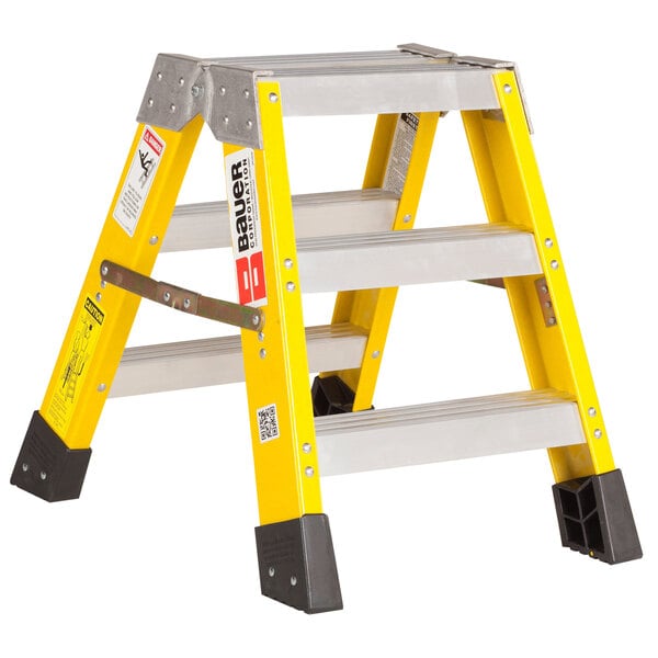 A yellow and black Bauer Corporation fiberglass step ladder.
