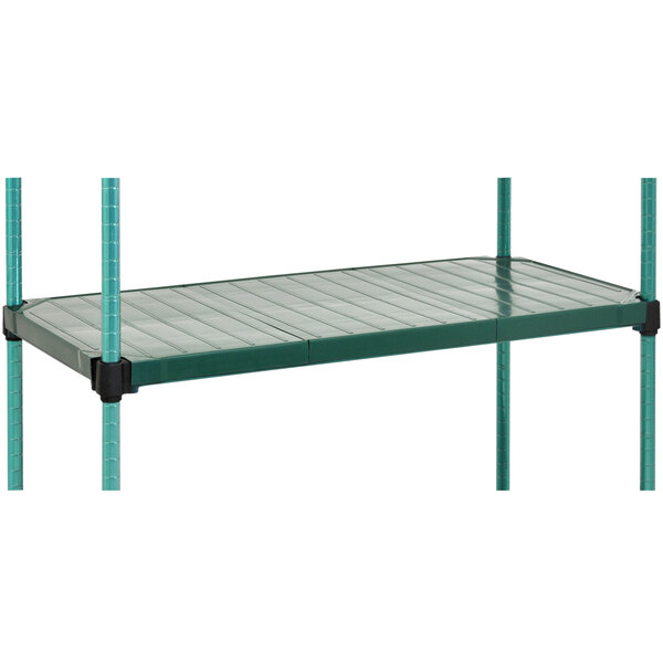 A green shelving unit with black legs and metal bars.
