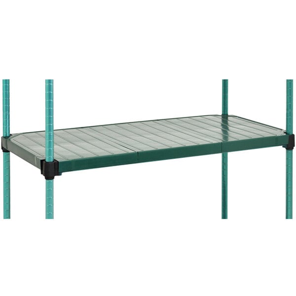 A green shelving unit with black metal bars.