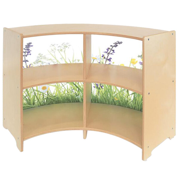 A Whitney Brothers wooden cabinet with plants and flowers on the shelves.