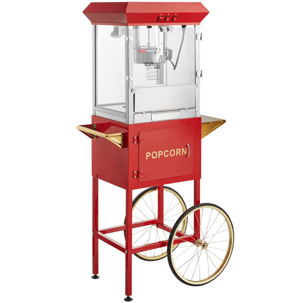 A red Carnival King popcorn machine on a cart.