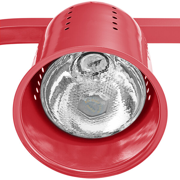 An Avantco red free standing heat lamp with a red bulb.
