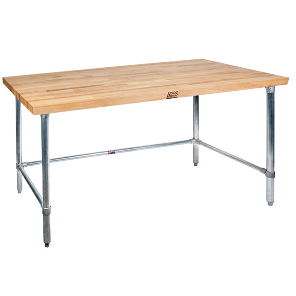 A John Boos wood top work table with a stainless steel base.