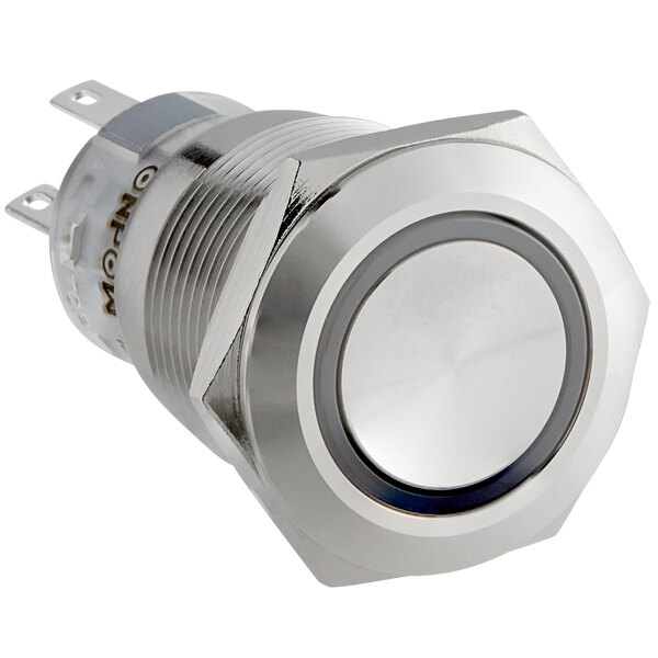 A silver push button with a white background.