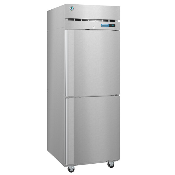 A silver Hoshizaki pass-through refrigerator with two half solid doors.