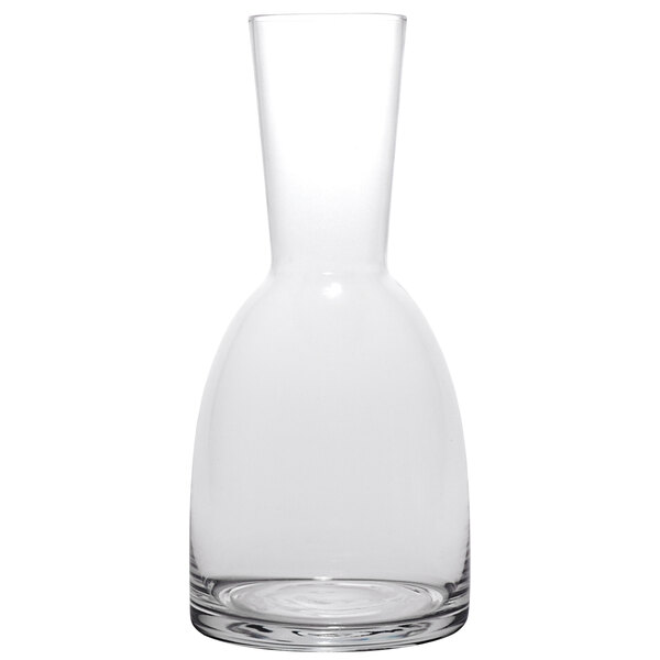 A clear glass Schott Zwiesel carafe with a curved neck.