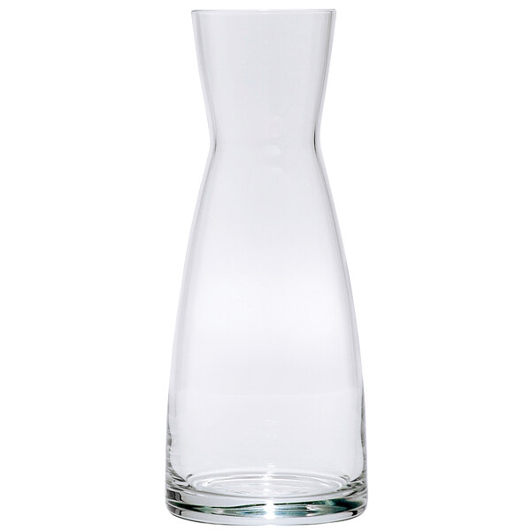 A clear glass carafe with a white background.