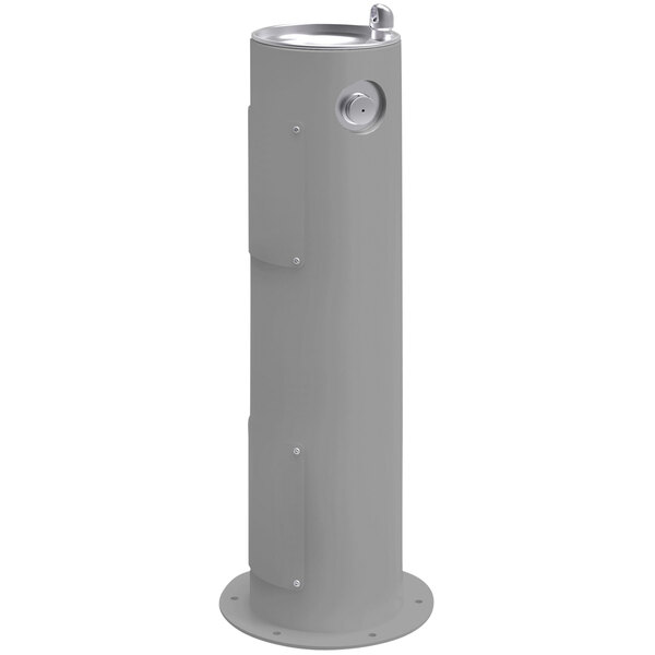 A grey Elkay outdoor vertical pedestal drinking fountain with a silver water spout.