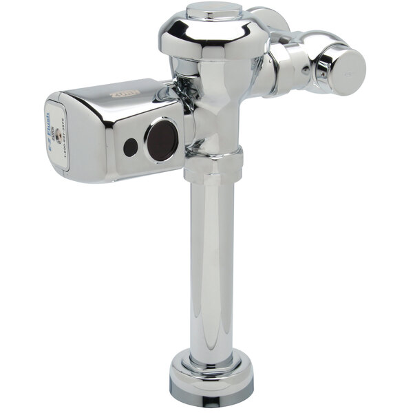 A chrome plated Zurn toilet flush valve with a metal sensor.