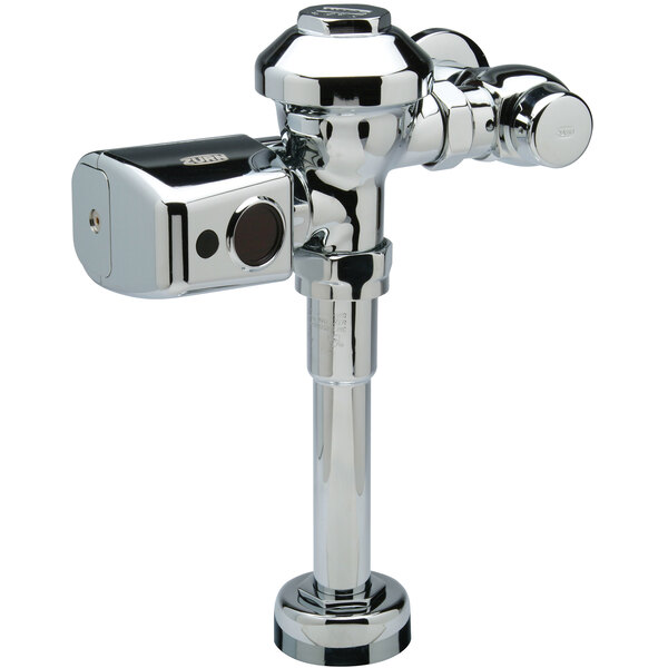 A Zurn chrome plated metal urinal flush valve with battery powered automatic sensor.