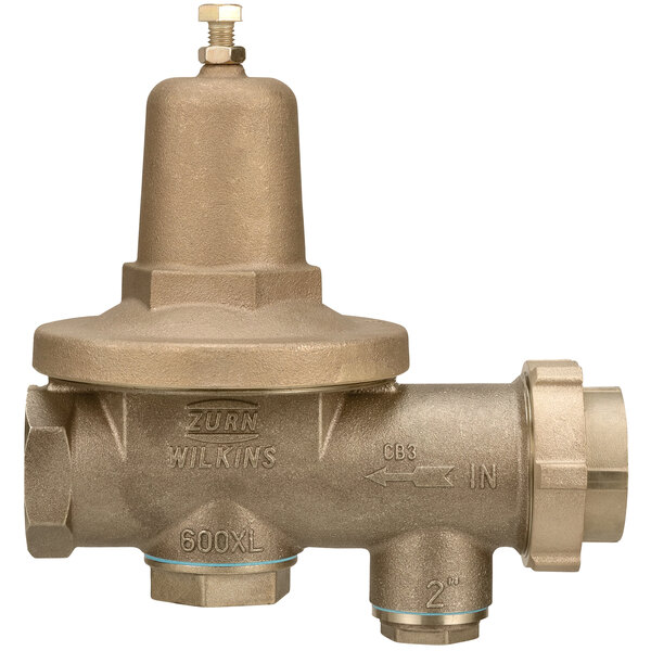 A close-up of a Zurn brass water pressure reducing valve.