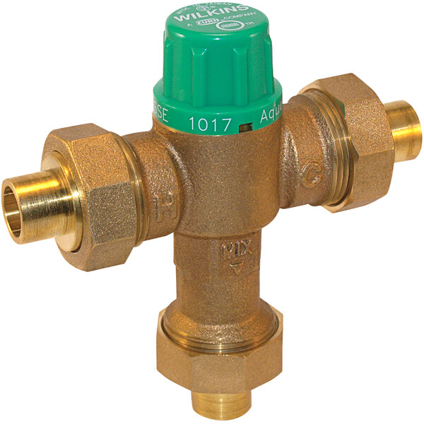 A Zurn brass tempering mixing valve with green and yellow buttons.