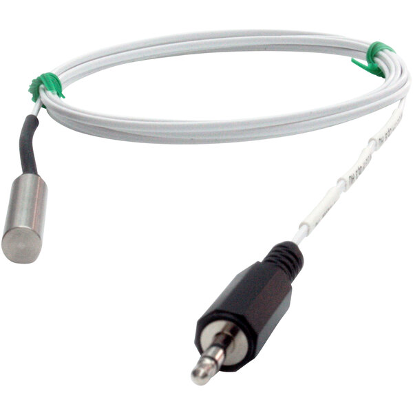 A white wire with a green plug on the end.