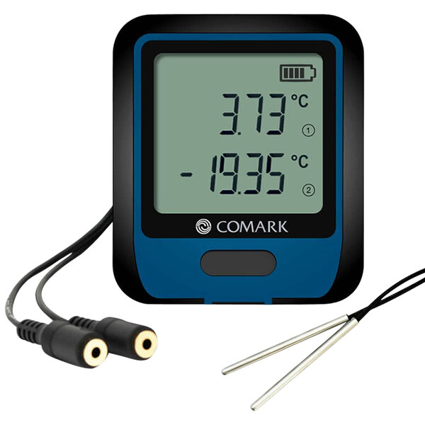 A Comark digital thermometer with two thermistor probes and wires.
