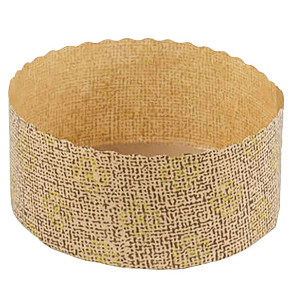 A brown paper baking mold with a gold pattern.