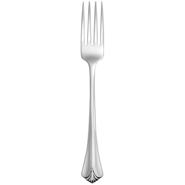 A stainless steel dinner fork with a white handle.