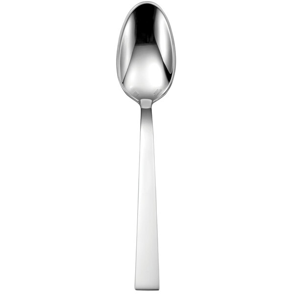 A close-up of a Sant'Andrea Elevation stainless steel oval bowl spoon with a long handle.