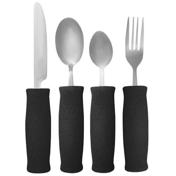 A black rectangular object with a white border containing a fork, knife, and spoon with black foam handles.
