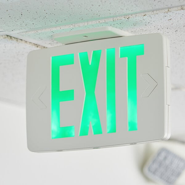 A Lavex green LED exit sign on a ceiling.