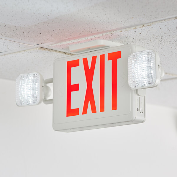 A Lavex red LED exit sign and emergency light combo mounted on a ceiling.