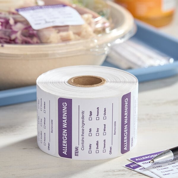 A roll of 2-inch by 2-inch removable allergen warning labels with checkboxes for common allergens, containing 500 labels per roll.