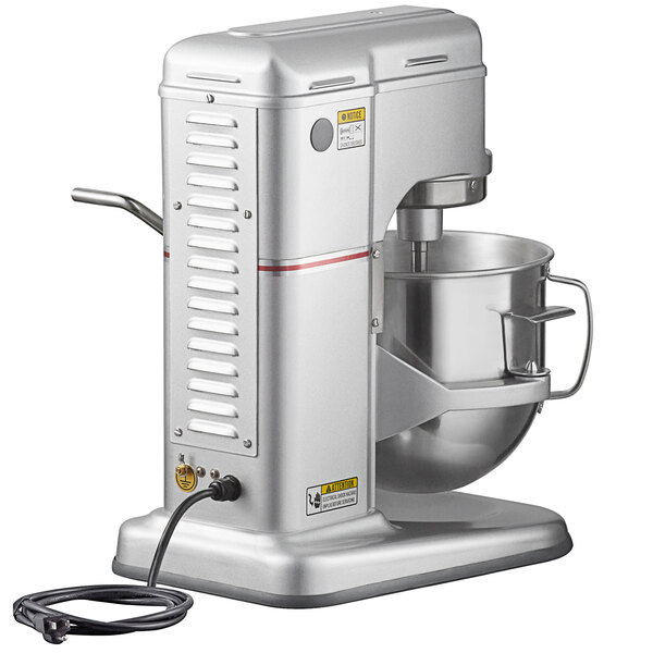 A silver Estella countertop mixer with a cord attached.