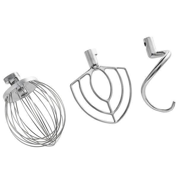 A silver Estella countertop mixer with metal kitchen tools.