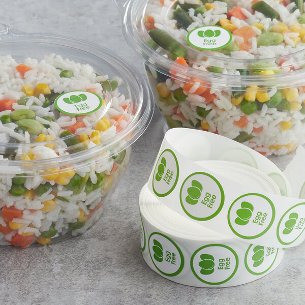 A group of plastic containers of rice and vegetables with Point Plus green "Egg Free" labels.