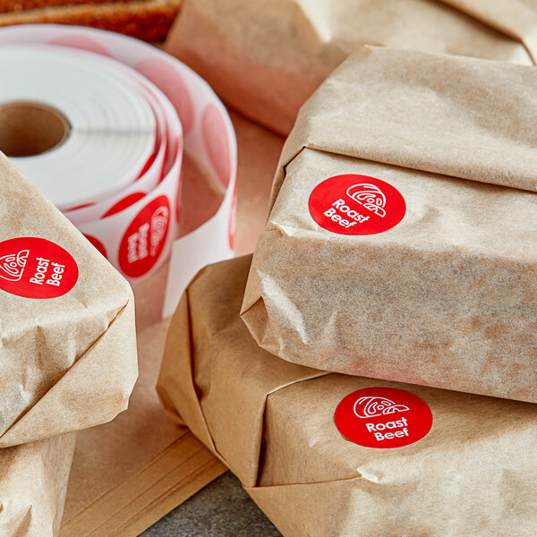 Brown paper packages with Point Plus roast beef labels on them.