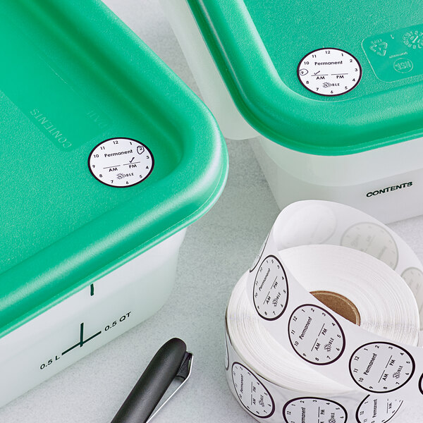 A green and white Noble Products container holding a roll of permanent clock labels.