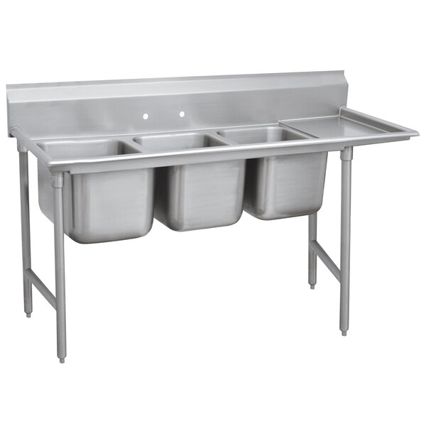 An Advance Tabco stainless steel Regaline three compartment sink with one drainboard on the right.