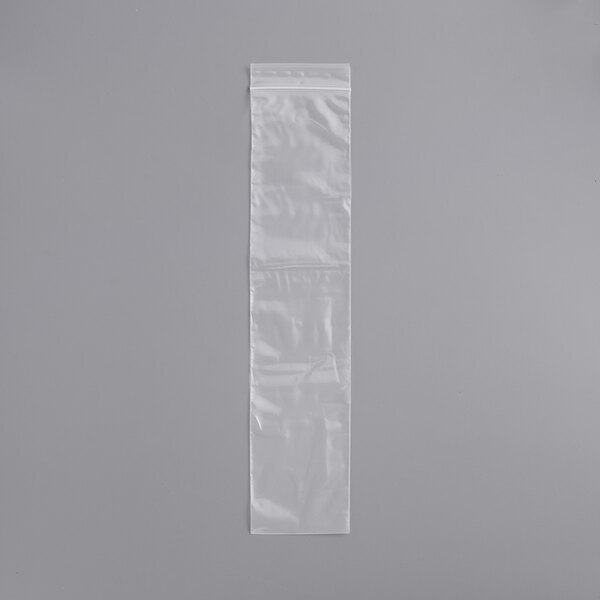 A clear plastic bag with a seal on a gray background.