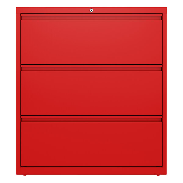 A red file cabinet with three drawers.