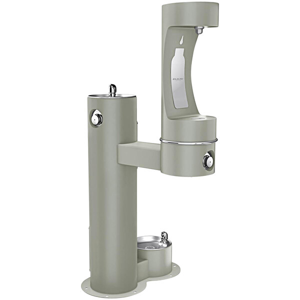 An Elkay gray outdoor bi-level pedestal drinking fountain with a water dispenser and a white cover.