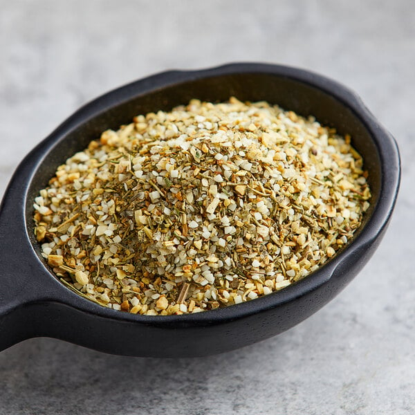 A black bowl filled with Lawry's Lemon, Basil, and Thyme Key West-Style Seasoning.