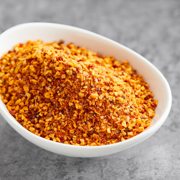 A bowl of Lawry's Roasted Garlic and Red Bell Pepper Seasoning.