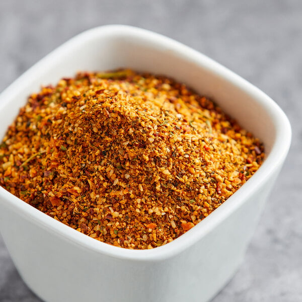 A white bowl with a mixture of Lawry's Sweet Basil, Citrus, and Garlic Rub spices.