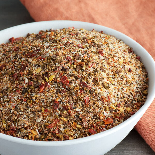 A bowl of Lawry's Pepper Supreme Seasoning on a table.