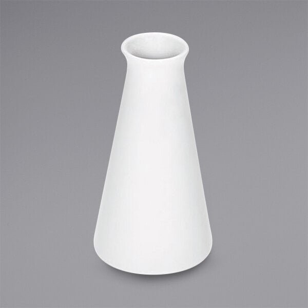A bright white porcelain Bauscher vase on a grey surface.