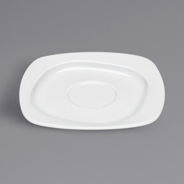 A Bauscher bright white porcelain saucer with a small square cut out.