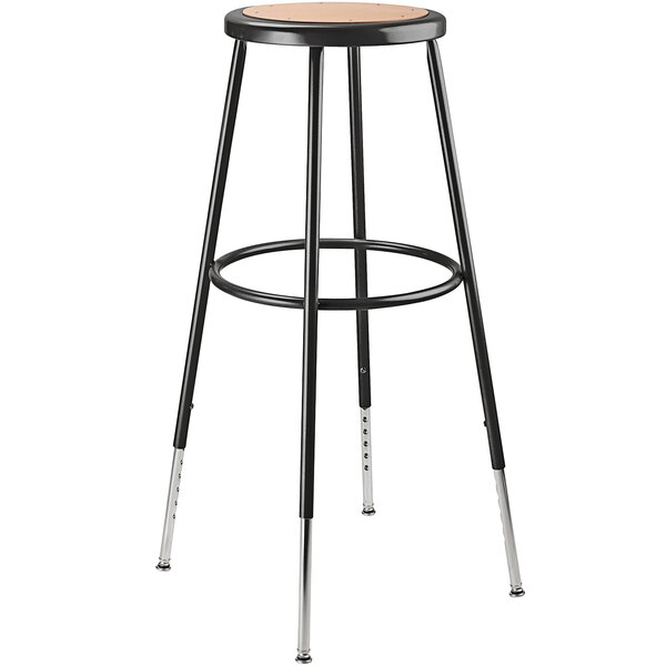 A black National Public Seating lab stool with a wooden seat and silver legs.