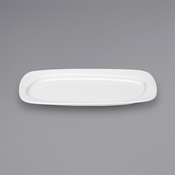 A Bauscher bright white rectangular porcelain platter on a gray background.