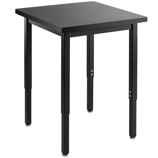 A black rectangular National Public Seating science lab table with metal legs.